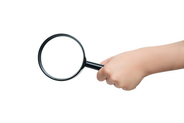 Magnifier in a children's hand on a white background. Close-up