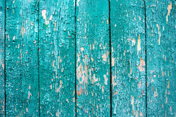 Fototapeta na wymiar Texture background from old wooden boards. Peeling green paint on wooden planks. Photography for design.