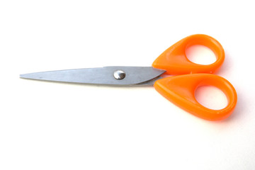 Orange scissor on white background.