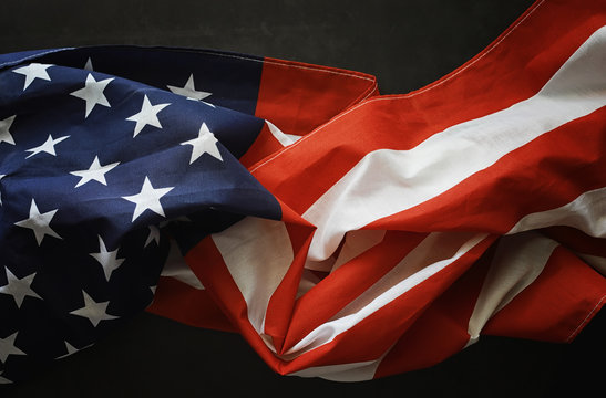 American flag on a black background. Space for text. - Powered by Adobe