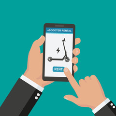 Rent electric scooter via your phone. Hand holding the phone. Scooter rentals app concept. 