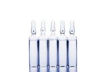 Glass medicine ampoules on a white background