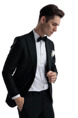 elegant young man thinking and looking down