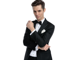 Naklejka premium young elegant man wearing tuxedo and thinking