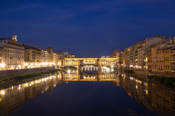 Beautiful view of the Ponte Vecchio bridge across the Arno River in Florence, Italy