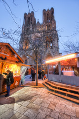 Yellow warm atmosphere at Reims Christmas market near famous cathedral, France - 298735440