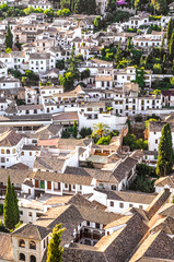 Fototapeta premium Historic Albaicin district in Granada, Andalusia, Spain photographed from above. Narrow winding streets with traditional houses dating back to medieval Muslim rule over the city. Moorish architecture
