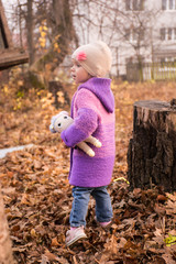 little girl in autumn park
