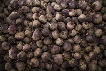 Fresh purple beets as a background