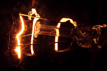 Working incandescent lamp in macro. Lamp.  Incandescent lamp