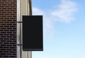 Blank black light box mockup on brick wall, sky background
