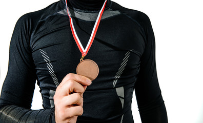 The athlete enjoys the bronze medal, third place. Player happy to win a bronze medal. The concept...