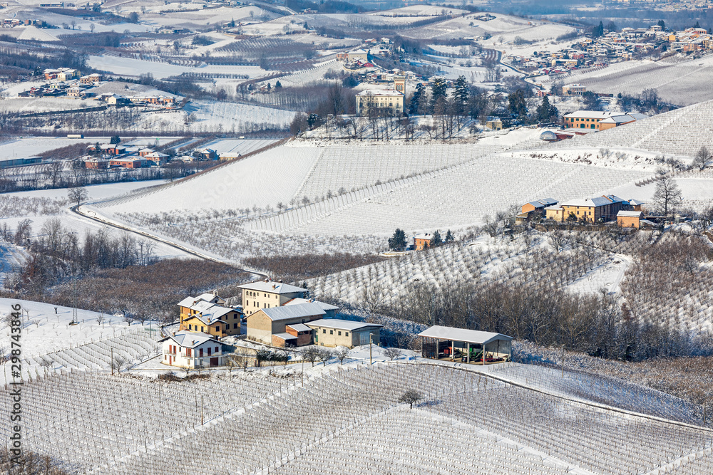 Wall mural small villages on snowy hills of northern italy.