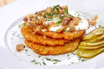 potato pancakes with bacon and sour cream