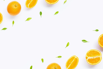 Frame made of fresh orange citrus fruit with leaves isolated on white background.