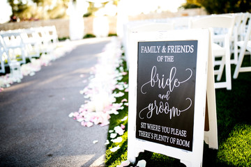 bride and groom aisle seating sign at ceremony
