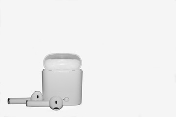 A pair of modern wireless headphones on a white background, space for lettering.