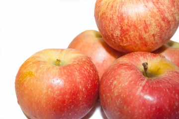 Red apples on white background with space for inscription