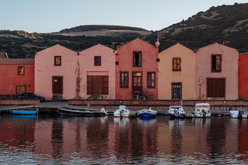 BOSA, ITALY / OCTOBER 2019: Life in the colorful fishermen's village in the north iof Sardinia
