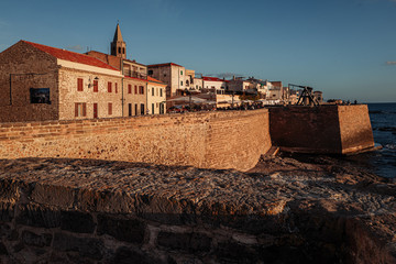ALGHERO, ITALY/ OCTOBER 2019:  Wonderful sunset over the ancient fortifications