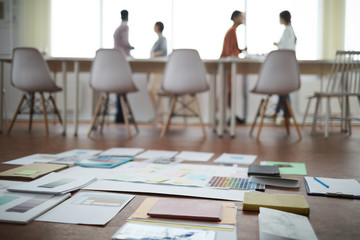 Concept of modern busines team planning project focus on documents and papers lying on floor in office, copy space