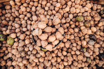 A basket full of fresh raw walnuts fruits