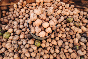 A basket full of fresh raw walnuts fruits