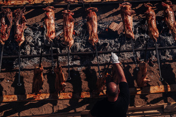 ORGOSOLO, SARDINIA /OCTOBER 2019: The old tradition of cooking the Porceddu Sardo, a young pig.