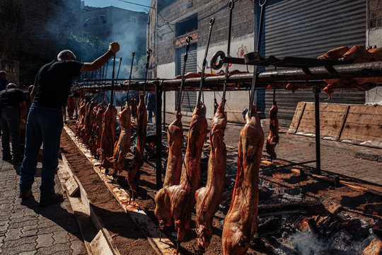 ORGOSOLO, SARDINIA /OCTOBER 2019: The old tradition of cooking the Porceddu Sardo, a young pig.