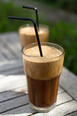 Traditional greek cold coffee Frappe made from water, instant coffee and ice cubes