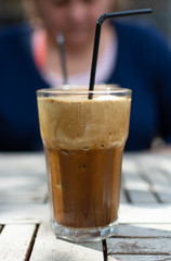 Traditional greek cold coffee Frappe made from water, instant coffee and ice cubes