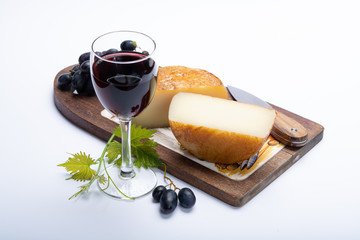 Hard Italian pecorino sheep cheese and glass with Italian red wine