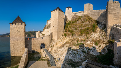 Fototapeta premium Summer afternoon view of restored medieval Golubac fortress, trdava Golubac on the bank of the Danube in Serbia for Yugoslavia across from Romania major tourist destination