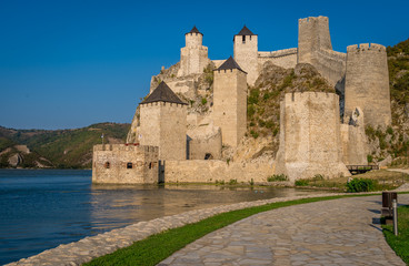 Fototapeta na wymiar Summer afternoon view of restored medieval Golubac fortress, trdava Golubac on the bank of the Danube in Serbia for Yugoslavia across from Romania major tourist destination