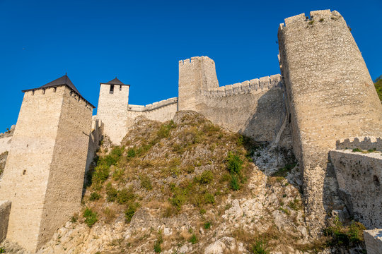 Summer afternoon view of restored medieval Golubac fortress, trdava Golubac  on the bank of the Danube in Serbia for Yugoslavia across from Romania major tourist destination