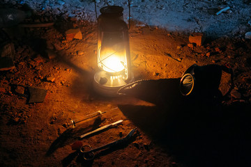 Carnival mask plague doctor, kerosene lamp, surgeon scissors and syringe