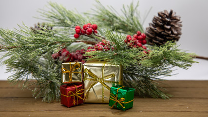 Holiday Wrapped Christmas Presents surrounded by Garland and festive appearance
