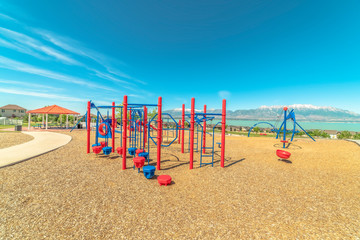Park with vivid childrens playground and pavilion picnic area overlooking lake