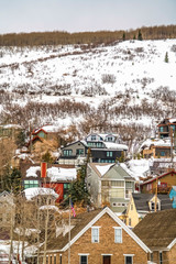 Fototapeta na wymiar Houses in Park City Utah on a mountain covered with snow during winter season