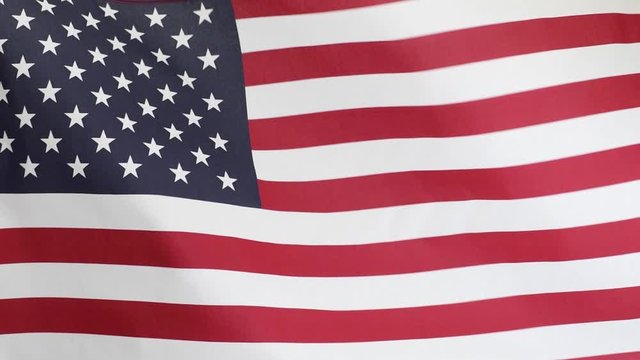 American Flag waving in wind in slow motion. United States flag