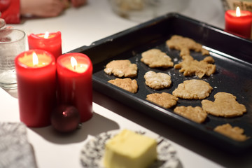 Baking tray with christmas cookies. Cooking of biscuits for Xmas holidays.