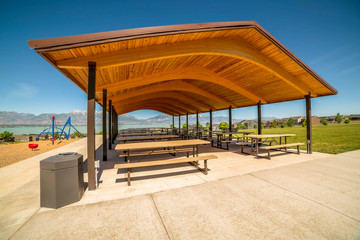 Pavilion at a park with view of lake and Timpanogos mountains on a sunny day