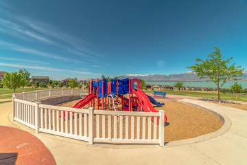 Playground with stunning view of lake and Timpanogis mountains under blue sky
