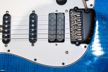 Blue White Electric Guitar. Electric guitar close-up with selective focus. A Part Of Electric Guitar