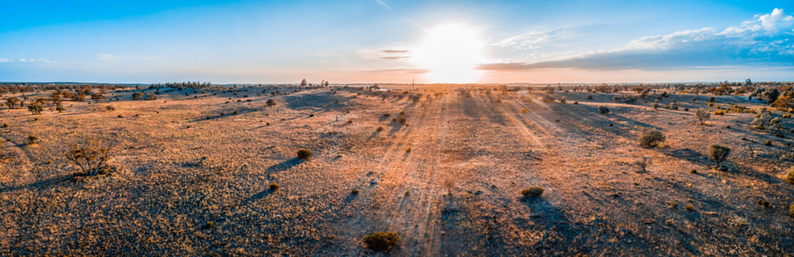 Sunrise over Australian desert - wide aerial panoramic landscape