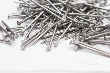 Selective focus of Close up Steel nails  on white background