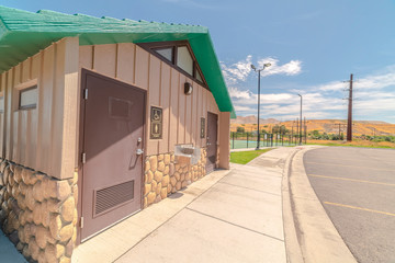 Naklejka premium Toilets at recreational fun park on sunny day
