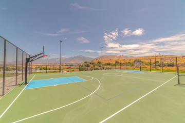 Outdoor turf basketball court on sunny, clear day