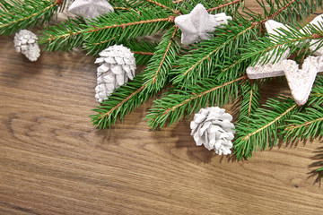 Obraz na płótnie Canvas Christmas card - Christmas tree branches on the wooden background