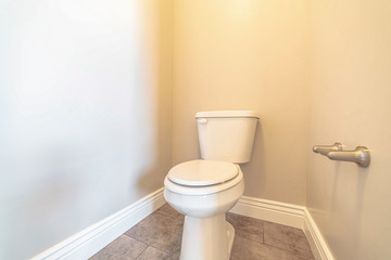 Fototapeta na wymiar A white toilet and cubicle in a modern household